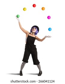 Clown playing with balls like a juggler