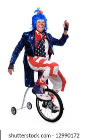 Clown Riding A Unicycle With Training Wheels