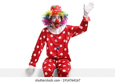 clown-sitting-on-white-panel-260nw-1914764167.jpg