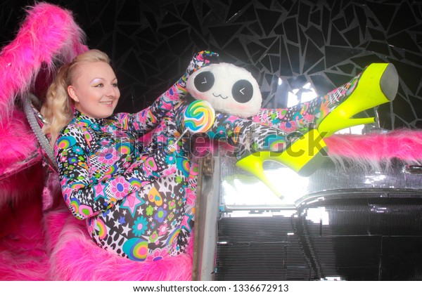 club\
party blonde girl in acid anime style spandex catsuit with mirror\
car with pink fur ready for crazy clubbing\
life