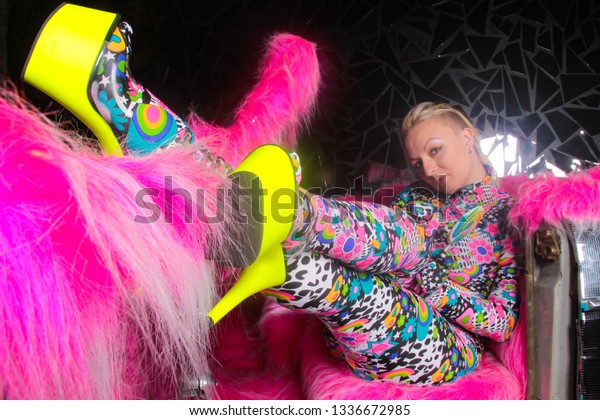 club
party blonde girl in acid anime style spandex catsuit with mirror
car with pink fur ready for crazy clubbing
life