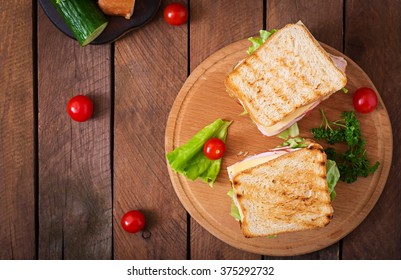 Club Sandwich With Cheese, Cucumber, Tomato, Ham And Eggs. Top View