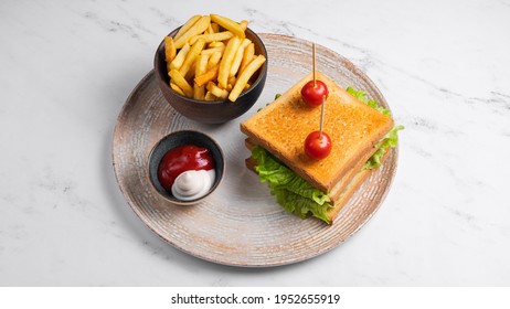 Club Sandwich With French Fries And Ketchup Mayonnaise Isolated On White.