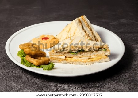 Club Sandwich with fried onion rings served in dish isolated on background top view of bangladesh food