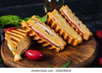 Club Sandwich With Ham, Cheese, Tomato And Salad. Grilled Sandwich With Dried Tomatoes Bread