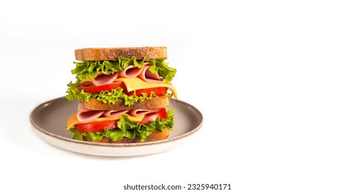 Club sandwich with ham, cheese, tomato and lettuce.  - Powered by Shutterstock