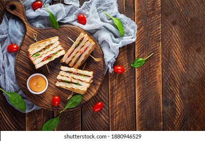 Club Sandwich With Ham, Tomato, Cheese And Spinach. Grilled Panini. Top View