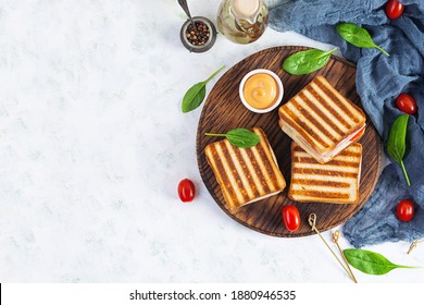 Club Sandwich With Ham, Tomato, Cheese And Spinach. Grilled Panini. Top View