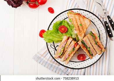 Club Sandwich - Panini With Ham, Cheese, Tomato And Herbs. Top View