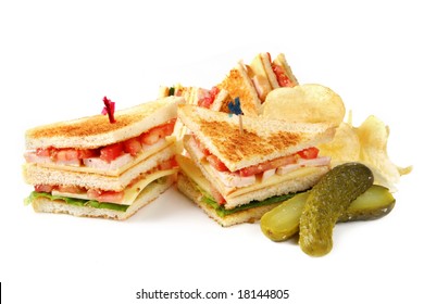 Club Sandwiches With Potato Chips And A Dill Pickle.  Isolated On White.