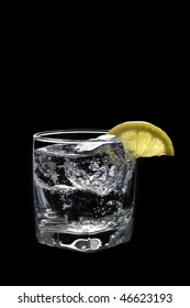 Club Soda Or Vodka / Gin And Tonic Mixed Drink With Lemon Slice On A Black  Background