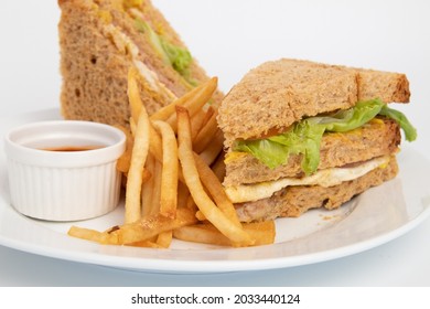 Clubhouse Sandwich - Grilled Ham, Plain Omelet, Sliced Chicken, Cheese, Tomato,
Cucumber And Lettuce In 3 Layered White
Bread Served With French Fries And Ketchup 