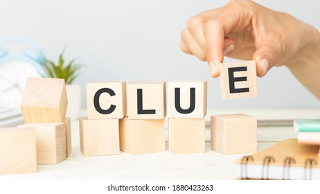 Clue Word From Wooden Blocks On Desk