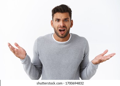 Clueless disappointed angry male client shocked with bad service, spread hands sideways in dismay and distressed, arguing looking questioned and frustrated, complain or condone someone