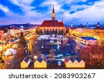 Cluj Napoca, Romania - Night scene with Christmas Market in Transylvania, Eastern Europe winter holiday scene.