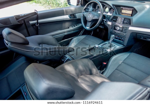 Cluj Napoca/Romania-June 20, 2018: Mercedes Benz\
W207-year 2010, E Class coupe,Avantgarde equipment;luxury leather\
interior, heated seats buttons, black upholstery, cruise control,\
dashboard, sport