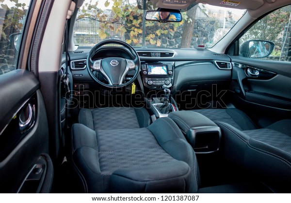 Cluj Napoca/Romania-November 07, 2018: Nissan\
Qashqai Acenta-year 2015, SUV car photo session on grass decor in\
autumn. Panoramic interior photo, detail photo, inside view, driver\
and passenger seats