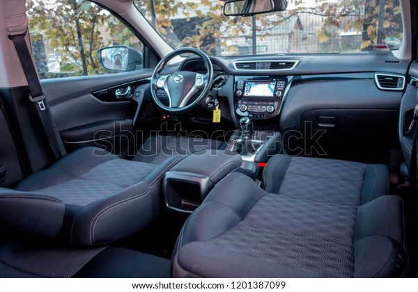 Cluj Napoca/Romania-November 07, 2018: Nissan\
Qashqai Acenta-year 2015, SUV car photo session on grass decor in\
autumn. Panoramic interior photo, detail photo, inside view, driver\
and passenger seats