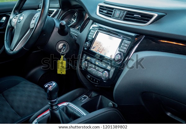Cluj\
Napoca/Romania-November 07, 2018: Nissan Qashqai Acenta-year 2015,\
SUV car photo session on grass decor in autumn. Panoramic interior\
close up photo, dashboard instrument cluster\
details