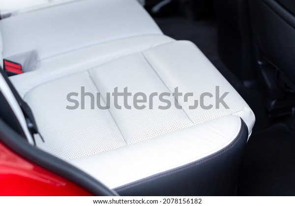 CLUJ, ROMANIA -\
Oct 08, 2019: A rear view inside Mazda CX-5 SUV - white leather\
upholstery, passenger\
backseat