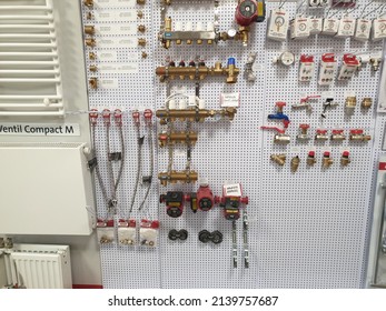 Cluj-Napoca, Cluj-Romania-03.14.2022-Fittings, hoses and tubings, clamps, valves, watts, ppr, henco, pexal, cuprit, instalattion parts hanged on a wall