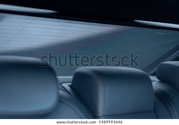 Cluj-Napoca, Cluj-Romania-05.06.2021-Car\
vehicle window sun shade roller blind, a protective shield for the\
window and interior UV\
protection
