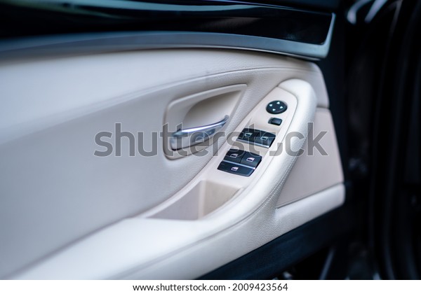 Cluj-Napoca, Cluj-Romania-07.09.2021-Wood grain and\
white leather come together to make up the beautiful interior of\
this BMW sedan. Every detail is crafted to create the perfect\
driving experience.\
