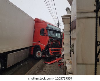 Cluj-Napoca, Romania - April 20, 2017-A Large Red And White Truck Caused An Accident That Resulted In The Demolition Of A Marble Fence Located In Front Of A Gypsy Villa. There Were No Human Casualties