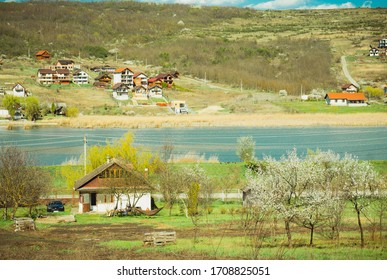 CLUJ-NAPOCA, ROMANIA - APRIL17, 2020: Countryside View. Old House With Big Backyard And Lake View In The Countryside, In Transylvania.