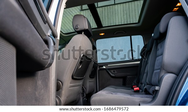 Cluj-Napoca,Cluj/Romania:07.01.2019-VW\
Touran facelift year 2012 panoramic sunroof detailed interior\
photo. Alcantara upholstery, big navigation display lcd, blue\
metallic\
paint