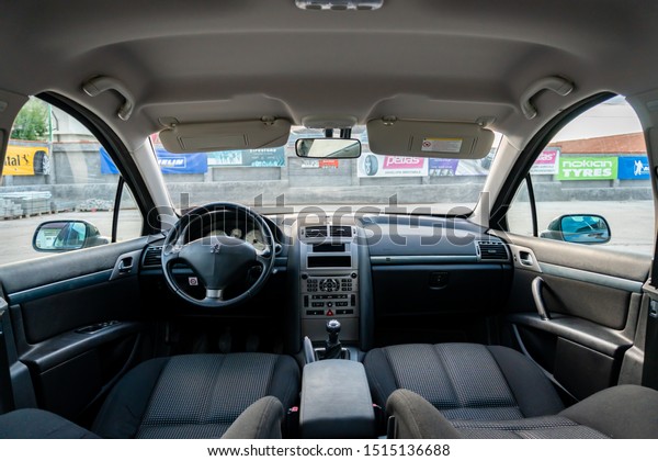Cluj-Napoca,Cluj/Romania-09.04.2019-Interior\
detailed photo of an Peugeot 407 sedan textile upholstery interior\
and\
dashboard