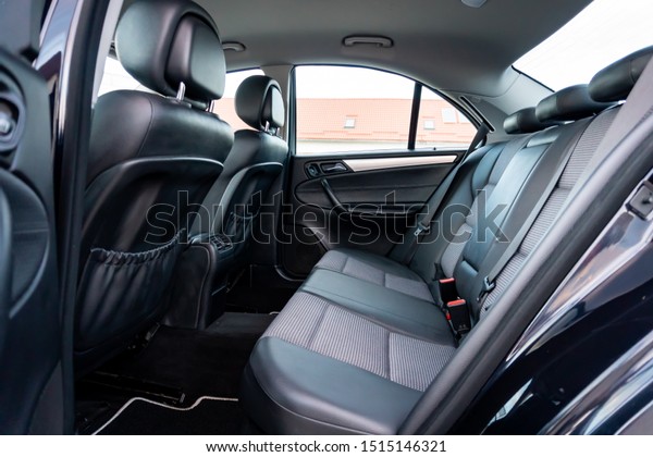 Cluj-Napoca,Cluj/Romania-09.04.2019-Mixed leather\
and textile upholstery car interior, big navigation display in a\
2005 Mercedes Benz W203 Avantgarde\
edition