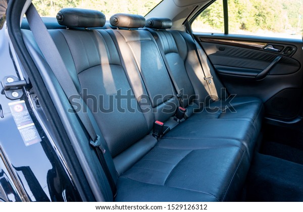 Cluj-Napoca,Cluj/Romania-09.21.2019-Mercedes\
Benz w203 black nappa leather perforated upholstery luxury car\
interior
