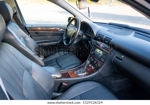 Cluj-Napoca,Cluj/Romania-09.21.2019-Mercedes\
Benz w203 black nappa leather perforated upholstery luxury car\
interior