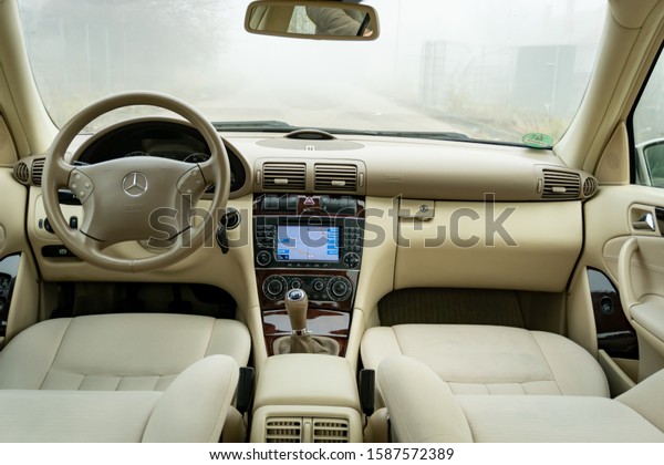 Cluj-Napoca,Cluj/Romania-12.12.2019-Well mentained\
beige textil upholstery inside a wonderful german sedan car,\
Mercedes Benz C Class, W203, Elegance equipment. Isolated, no\
people, empty parking\
lot