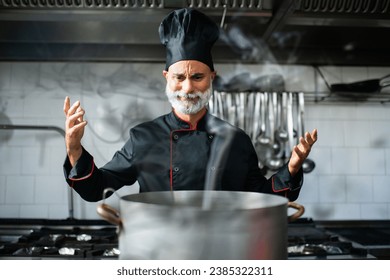 Clumsy chef doing disasters while cooking