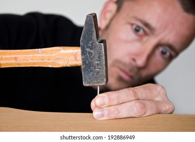 Clumsy Man With Hammer