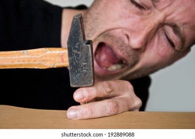 Clumsy Man With Hammer