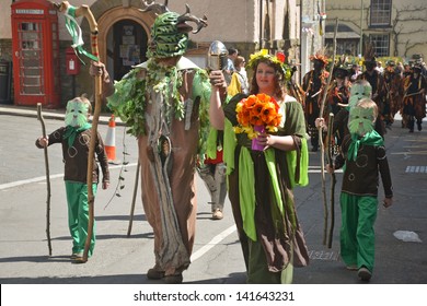 CLUN, UK MAY 6: The Green Man And May Queen In May Day Procession In Clun, Shropshire, May 6 2013. The Green Man Festival Is An Annual May Day Bank Holiday Celebration.