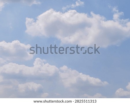 A cluster of beautiful clouds in the blue sky during the day.