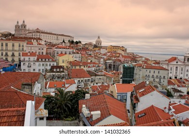 Cluster of buildings of Lisbon city, Portugal at sunset