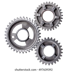 A cluster of interlocking metal gears isolated on a white background. 