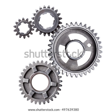 A cluster of interlocking metal gears isolated on a white background. 