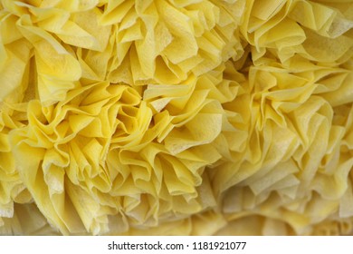A Cluster Of Yellow Tissue Paper Flower Puff Balls