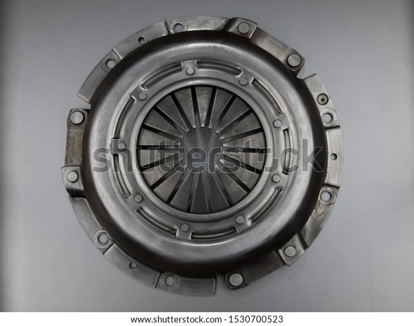 Clutch car basket on a gray background. Top view\
car service.