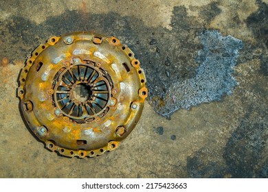 Clutch Cover Expire On Background Gear Transmission.expire On Dirty Background.There Are Rust Stains.maintenance Services Clutch.