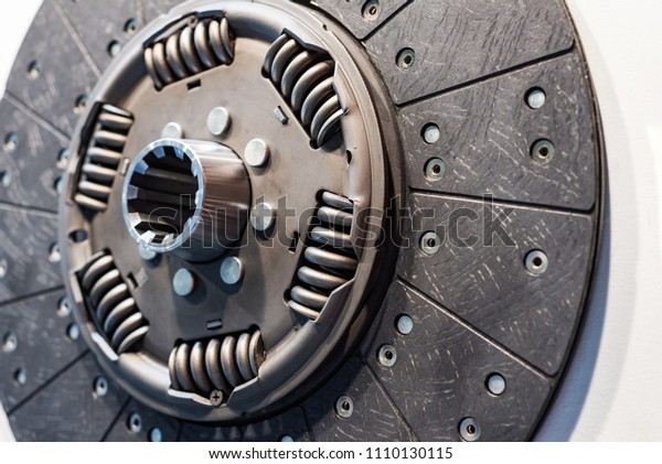 Clutch disc for a\
car engine. Close-up\
photo.