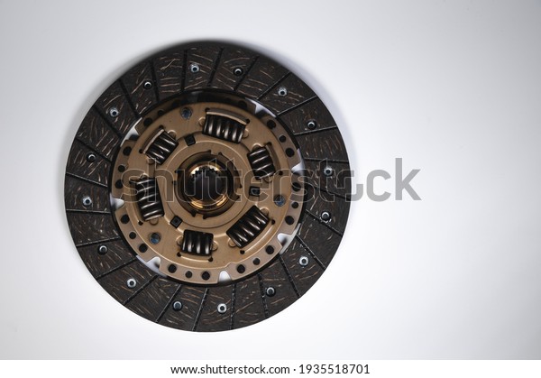 Clutch disc of a manual transmission of a\
passenger car on a gray\
background