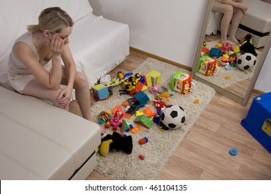 Clutter In The Nursery. Mom Is Tired Of Looking At Toys. The Mess In The House