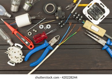 Clutter On The Workbench. Tools, Electronics Repairman. Repair Of Household Electrical Equipment. Sales Of Electronics Components. Advertising On Servicemen.